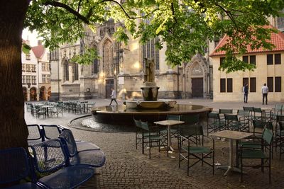 Empty chairs and tables in cafe