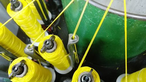 Low section of man playing with yellow ball