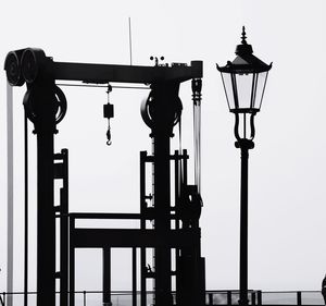 Low angle view of street light against sky