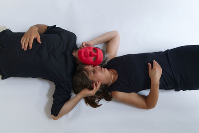 Rear view of two women lying down