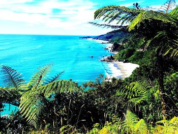 Scenic view of sea against blue sky