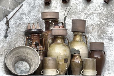 Old containers against wall