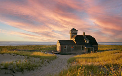 Cape cod beach house at provincetown sunset. 