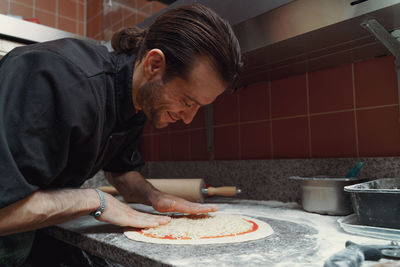 Man preparing food in kitchen