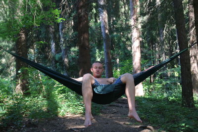 Portrait of young man in forest