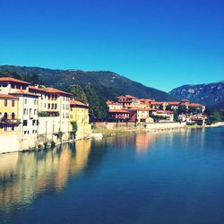 Houses in town against clear sky