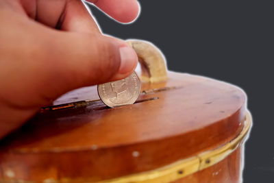 Close-up of hand holding cigarette