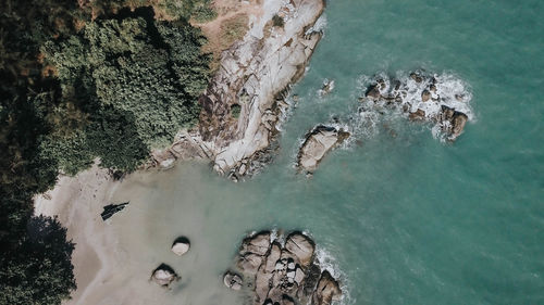 High angle view of rock formation in sea