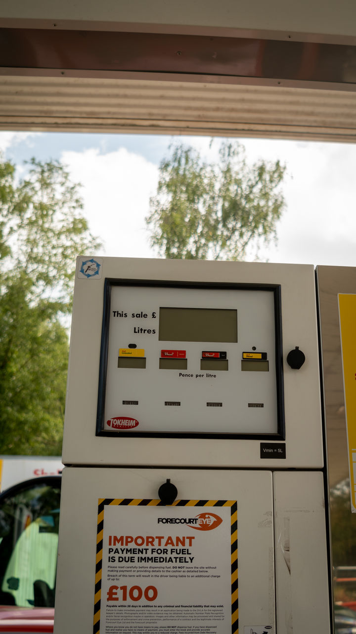 power generation, technology, fuel pump, text, control panel, no people, communication, gas station, outdoors, vehicle, architecture, day, nature, industry, tree