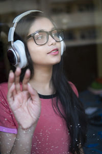 Portrait of young woman with camera