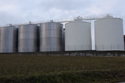 Low angle view of factory against sky