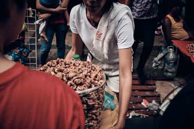 People at market stall