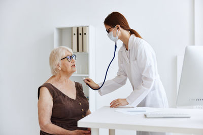 Woman standing on table