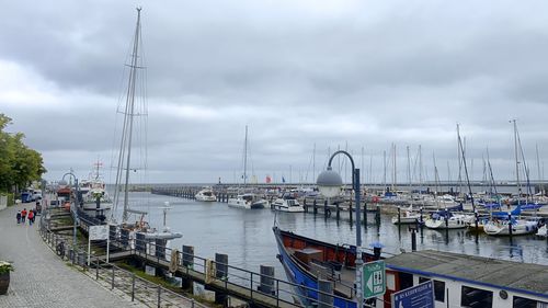 Boats moored at harbor