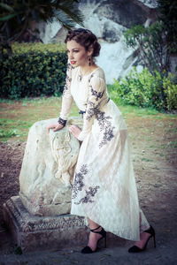 Portrait of young woman standing outdoors