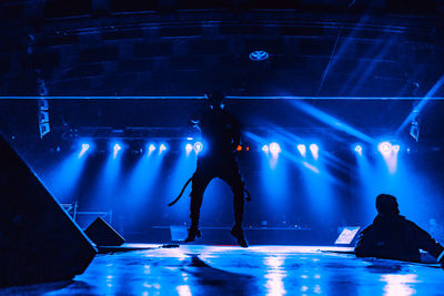 Silhouette man performing at concert