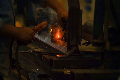 Man working on metal