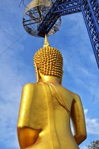 Low angle view of statue of buddha against sky