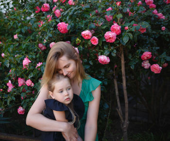 Beautiful woman with pink flower