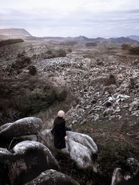 Man on landscape against sky