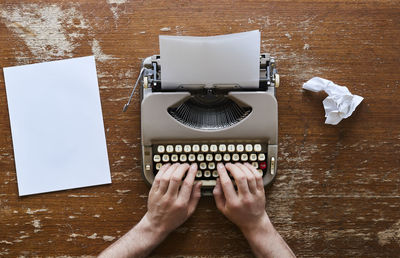 Directly above shot of woman hand on table