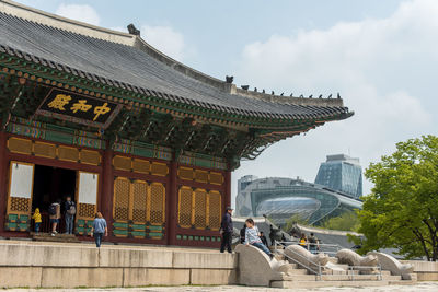 Group of people in front of building