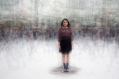 Digital composite image of beautiful woman standing on street
