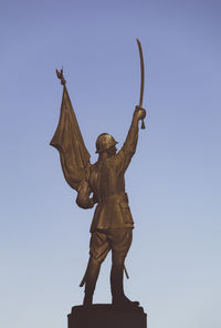 Low angle view of statue against clear sky