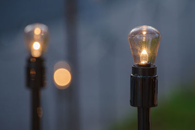 Close-up of illuminated light bulb