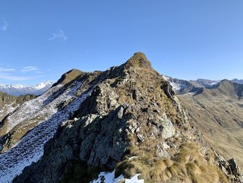 Scenic view of snowcapped mountains against clear sky