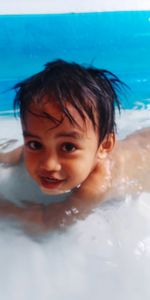 Portrait of boy in swimming pool