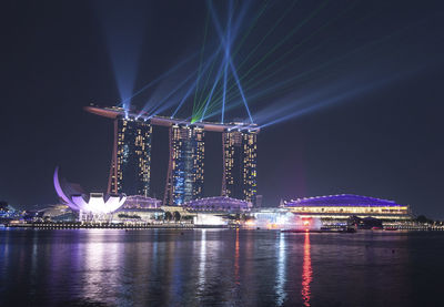 Illuminated city at night in singapore