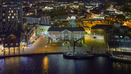 An aerial view of the old custom house overlooking neptune marina in ipswich, uk at night