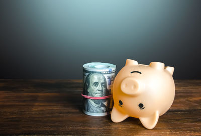 Close-up of piggy bank on table