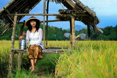 Portrait of woman standing in farm