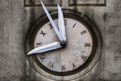 Close-up of clock on wall