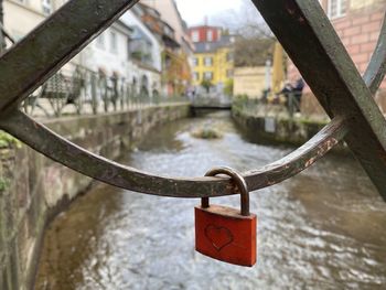 Close-up of padlocks on railing