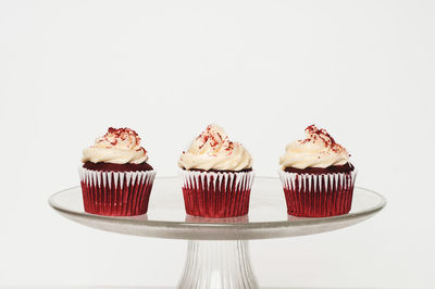 Close-up of cupcakes against white background