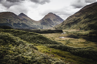Scenic view of landscape and mountains against sky