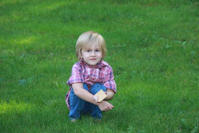 Portrait of smiling girl on grass