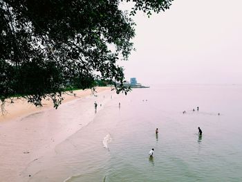 High angle view of people on beach against sky