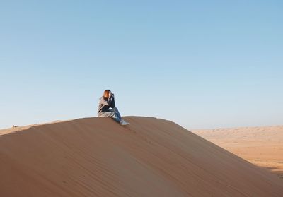 Woman on sand dune