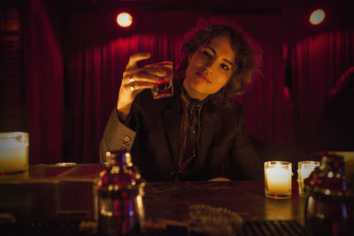 Woman enjoying a drink at a bar