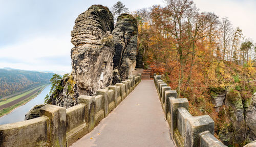 Popular bastei bridge in the national park saxon switzerland, germany. autumn colors of leaves