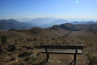 Landscape in swaziland - a view into the distance and a bench in the foreground
