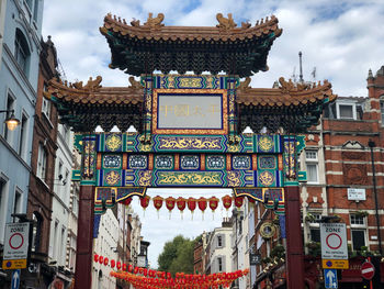 Low angle view of temple against sky in city