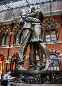 Low angle view of statue against building