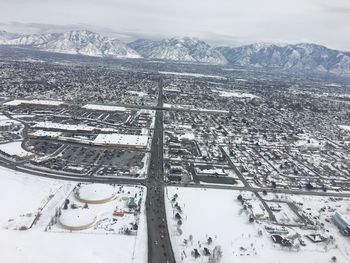High angle view of snow covered cityscape
