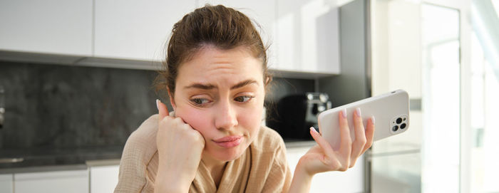 Young woman using mobile phone