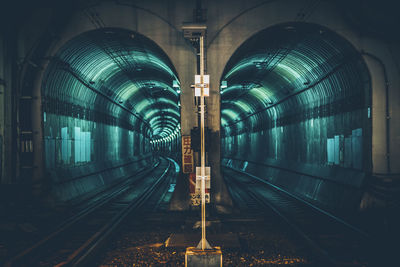 View of illuminated railroad tunnel